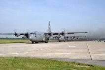 YOUNGSTOWN AIR RESERVE STATION, Ohio - A group of C-130 Hercules tactical cargo transport aircraft, assigned to the Air Force Reserve's 910th Airlift Wing, based here, taxi on the flightline prior to taking off for an eight aircraft training mission, June, 22, 2013. Air Force structure changes removed two C-130's from the wing's inventory, effective Oct. 1, 2013. Addditionally, two more aircraft will be removed form the unit's inventory and approximately 200 related  positions will be eliminated from the wing's manning document by March 31, 2014. Following these force structure changes, eight C-130s will be assigned to the 910th Airlift Wing, home of the Department of Defense's onmly large-area, fixed wing aerial spray capability. U.S. Air Force photo by Staff Sgt. Megan Tomkins 