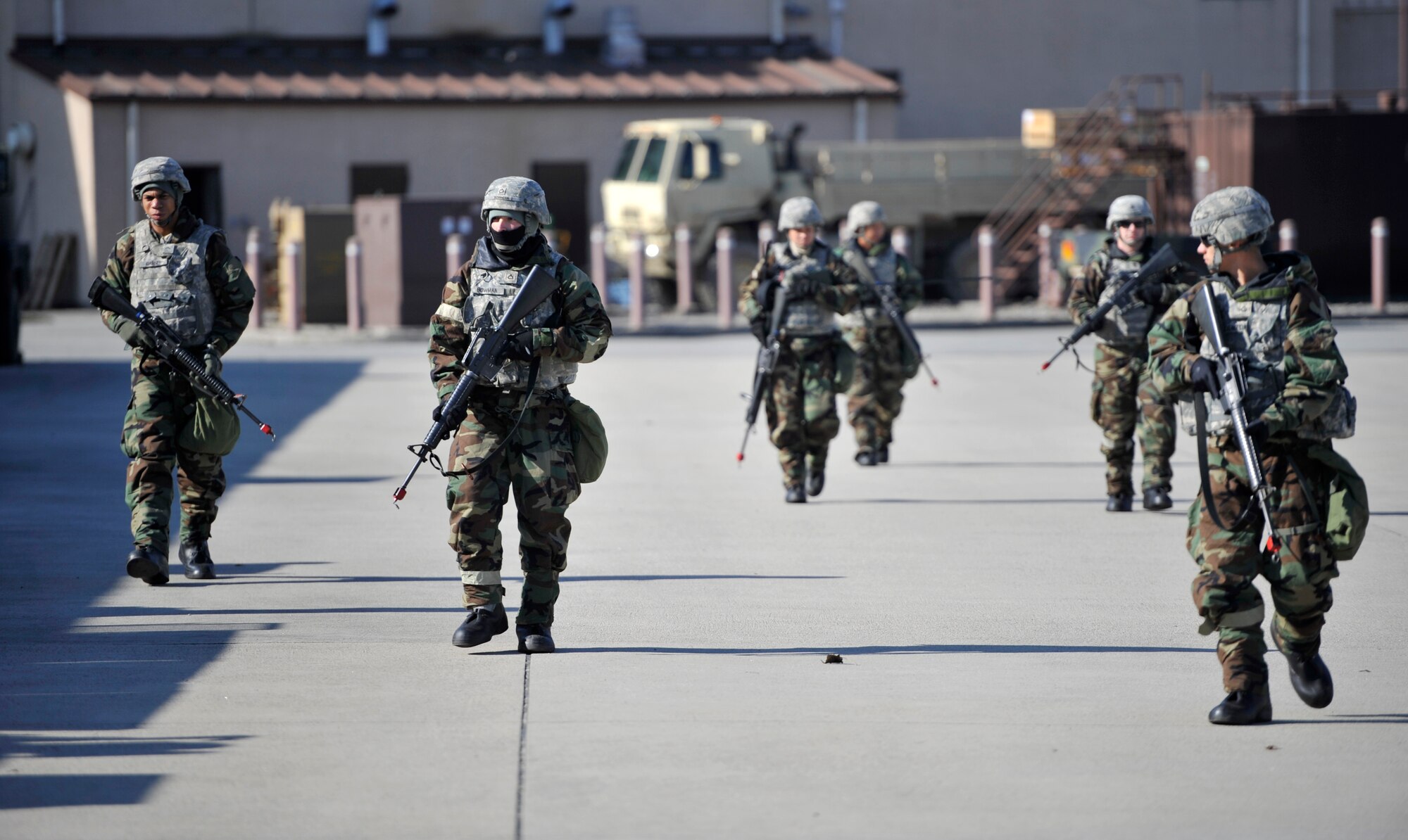 U.S. Army Soldiers from the 35th Air Defense Artillery Brigade execute a squad movement during Operational Readiness Exercise Beverly Bulldog 14-01 at Osan Air Base, Republic of Korea, Nov. 20, 2013. Soldiers from the 35th ADAB teamed up with the 51st Security Forces Squadron to exercise the tactics and procedures they would use to defend the base during an actual attack. (U.S. Air Force photo/Staff Sgt. Emerson Nuñez)  