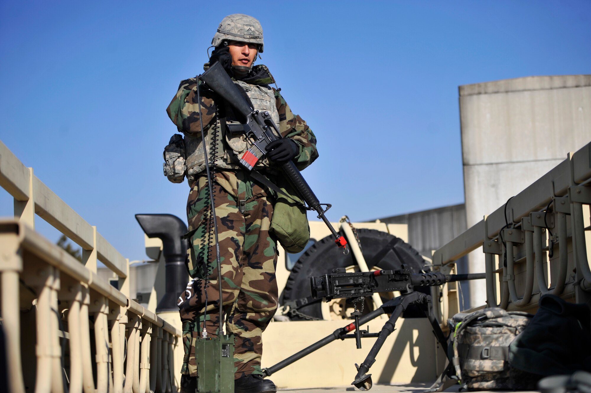U.S. Army Pvt. Brandon Gardner, 35th Air Defense Artillery Brigade operator maintainer, speaks on a radio before an opposition forces training exercise during Operational Readiness Exercise Beverly Bulldog 14-01 at Osan Air Base, Republic of Korea, Nov. 20, 2013. OREs such as BB 14-01 test the capabilities of both Soldiers and Airmen to work together and defeat the enemy in wartime scenarios. (U.S. Air Force photo/Staff Sgt. Emerson Nuñez)
