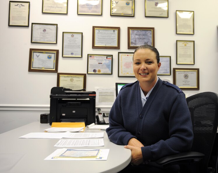 U.S. Air Force Staff Sgt. Regina Cooper, 336th Recruiting Squadron enlisted accessions recruiter, sits at her desk in Valdosta, Ga., Nov. 13, 2013. Cooper has been a recruiter for three years and has recruited approximately 120 applicants. (U.S. Air Force photo by Senior Airman Olivia Bumpers/Released) 