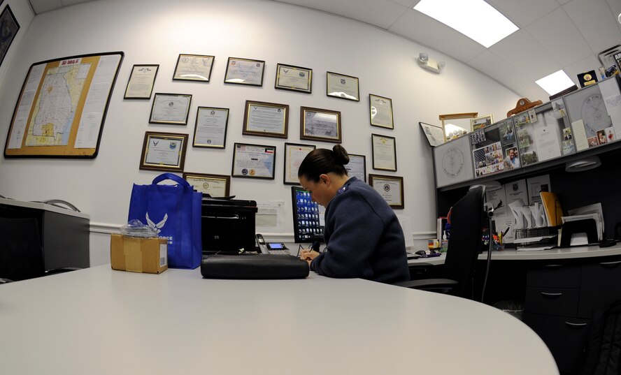 U.S. Air Force Staff Sgt. Regina Cooper, 336th Recruiting Squadron enlisted accessions recruiter, checks messages on her answering machine in Valdosta, Ga., Nov. 13, 2013. Cooper begins her day at 9 a.m. by checking messages from potential recruits. (U.S. Air Force photo by Senior Airman Olivia Bumpers/Released) 