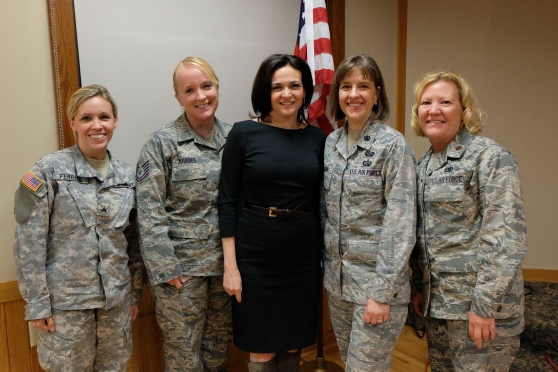 Facebook Chief Operating Officer Sheryl Sandberg stands with (l to r) Sgt. Dajon Ferrell, U.S. Army; Tech. Sgt. Lynette Olivares, 133rd Air National Guard; and  Lt. Col. Erika Cashin and Maj. Susan McMullen, 934th Airlift Wing, during a visit to the 934th Airlift Wing Officer's Club Oct. 1.  Sandberg, the author of the book "Lean In", talked with women and their daughters about some of their career challenges for women in the military and federal civil service. (Courtesy Photo)

