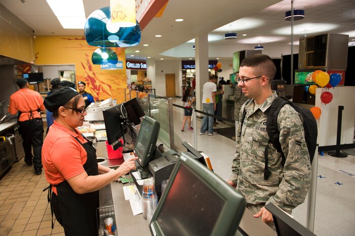U.S. Air Force Airman 1st Class Colby Alexander, 57th Aircraft Maintenance Squadron avionics specialist, orders a smoothie at the Exchange Denny’s Fresh Express, Nov. 19, 2013, at Nellis Air Force Base, Nev. As the newest addition to the Exchange food court, Denny’s offers menu options that were previously unavailable. (U.S. Air Force photo by Airmen 1st Class Thomas Spangler)