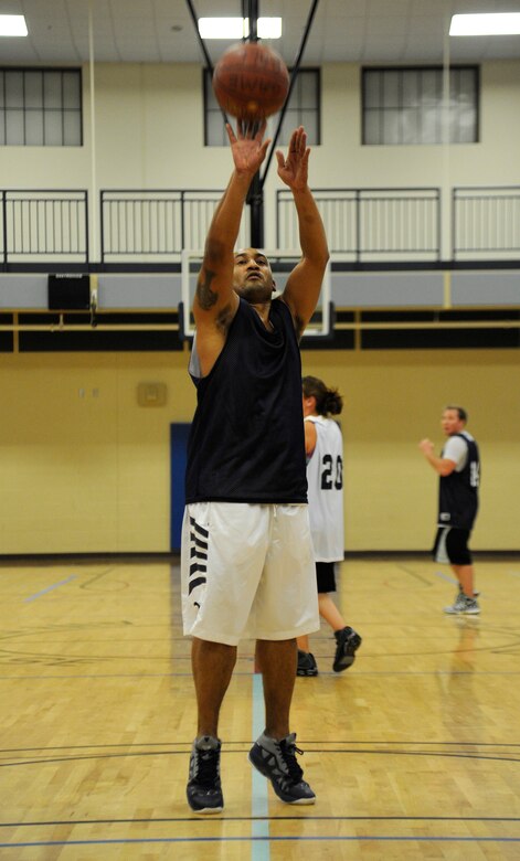 A member from the maintenance team takes a free throw shot after being fouled by the opposing team during an intramural basketball game in the fitness center at Fairchild Air Force Base, Wash., Nov. 14, 2013. (U.S. Air Force photo by Airman 1st Class Ryan Zeski/Released)