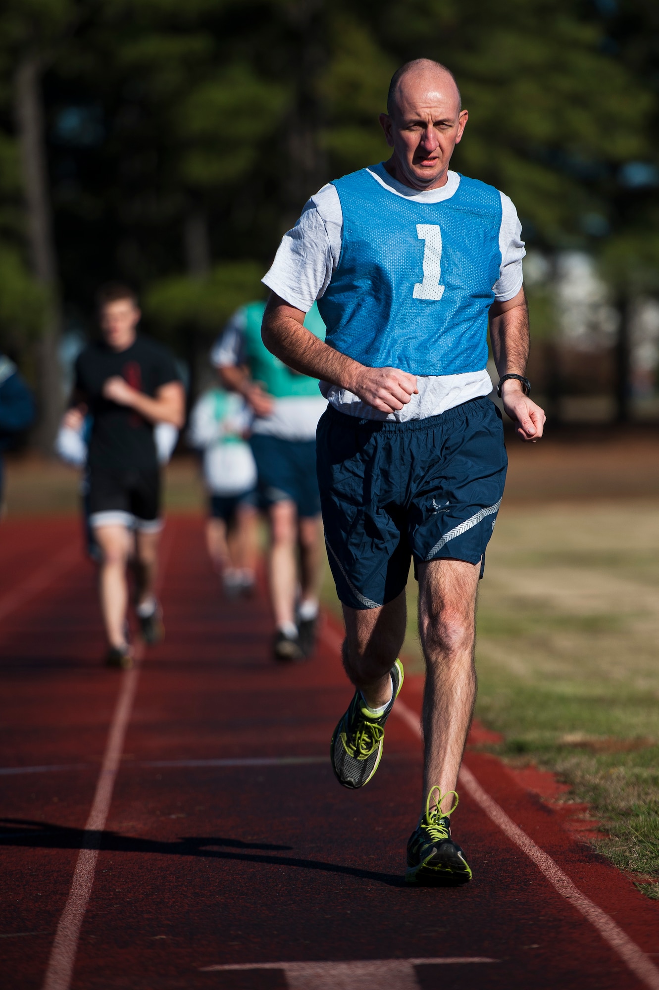 Chief Master Sgt. Kenneth Meierhofer, the 19th Civil Engineering Squadron chief enlisted manager, leads the 1.5-mile run during his physical fitness test Nov. 7, 2013, at Little Rock Air Force Base, Ark. For more information on PT testing, contact your unit fitness program monitor or the fitness assessment cell. (U.S. Air Force photo by Staff Sgt. Russ Scalf)