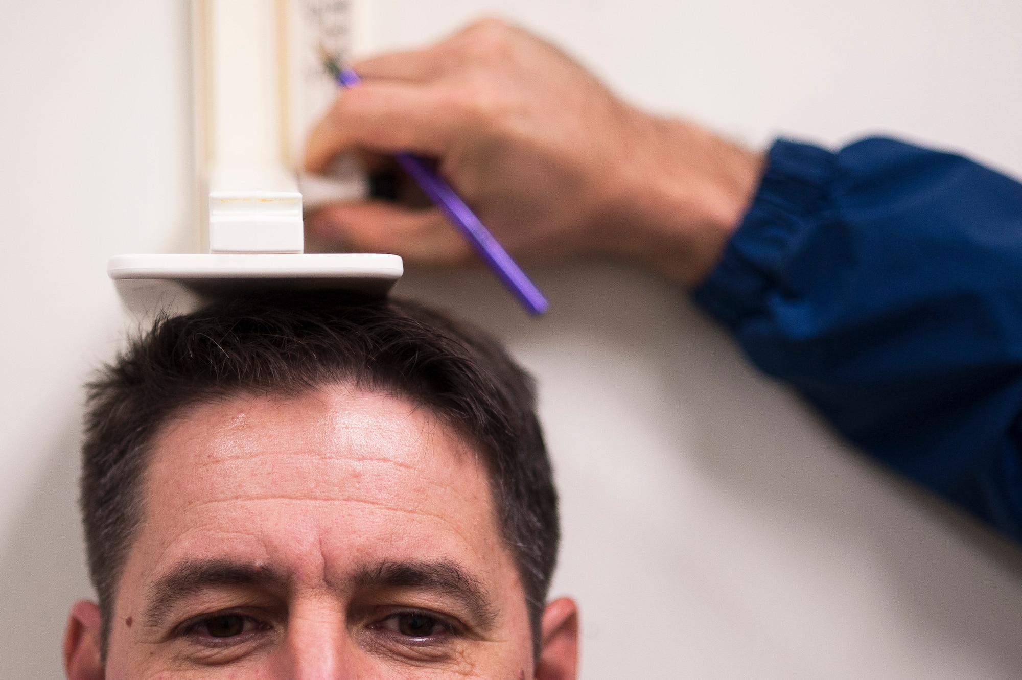 Chief Master Sgt. Paul Lawson, a 314th Aircraft Maintenance Squadron superintendent, is measured for his physical fitness test Nov. 7, 2013, at Little Rock Air Force Base, Ark. The test was Lawson’s last, as he is preparing to retire soon.(U.S. Air Force photo by Staff Sgt. Russ Scalf)