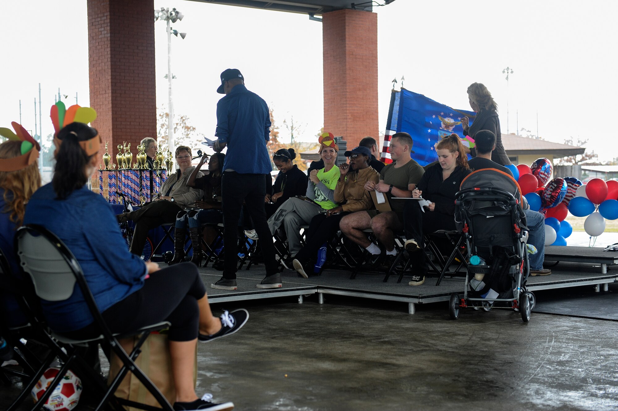 Couples attending the Month of the Military Family event participate in a dating game for couples Nov. 16, 2013, at Little Rock Air Force Base, Ark. The event hosted several different games, prizes for event winners and free food for all families and military members that attended. (U.S. Air Force photo by Staff Sgt. Jessica Condit)
