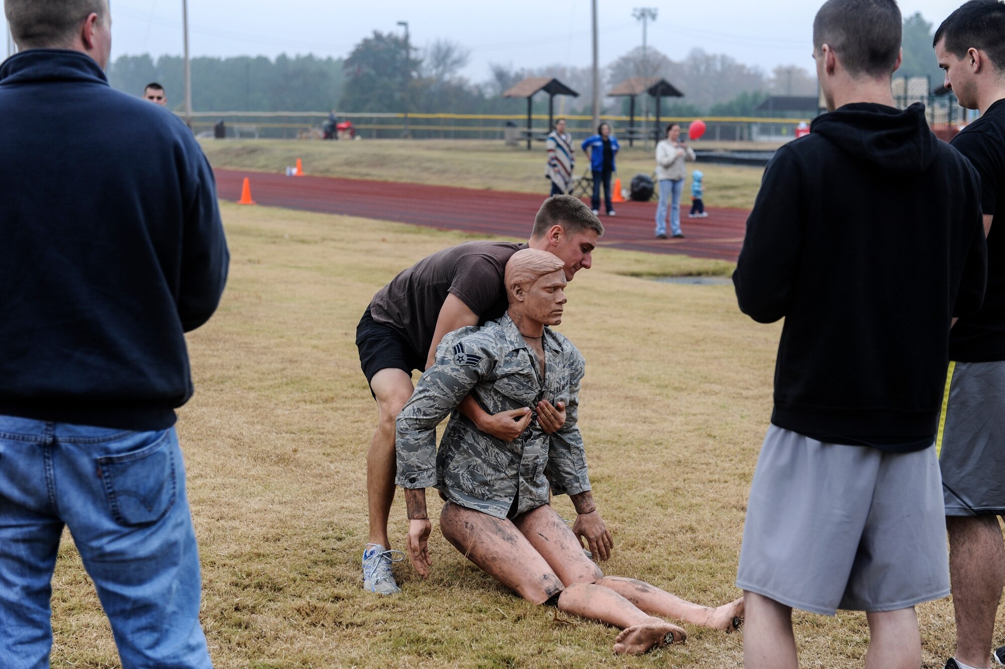 1st Lt. Noah Palicia, a 41st Airlift Squadron pilot, drags a dummy across the field during the Ultimate Fitness Challenge Nov. 16, 2013, at Little Rock Air Force Base, Ark. The Ultimate Fitness Challenge was part of the Month of the Military Family event held at the Warfit Pavilion in order to inform military families of benefits and provide families with opportunities to have fun. (U.S. Air Force photo by Staff Sgt. Jessica Condit)