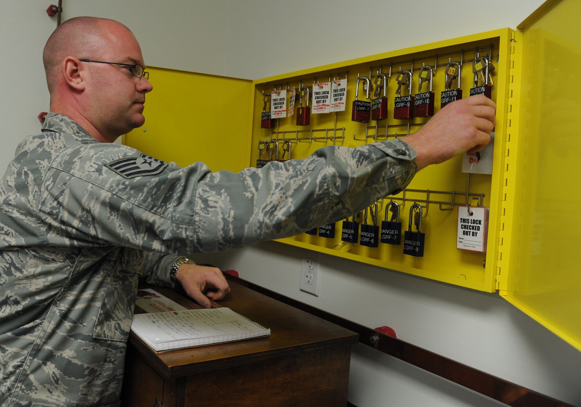 Staff Sgt. Matthew Gierak, 19th Logistics Readiness Squadron noncommissioned officer in charge of fuels environmental safety office, performs lockout/tag out key inspections, Nov. 18, 2013, at Little Rock Air Force Base, Ark.  Gierak's preparation for the Unit Effectiveness Inspection secured zero findings for the flight. Gierak was officially recognized by the group as a superior performer during the UEI. (U.S. Air Force photo by Staff Sgt. Jessica Condit)