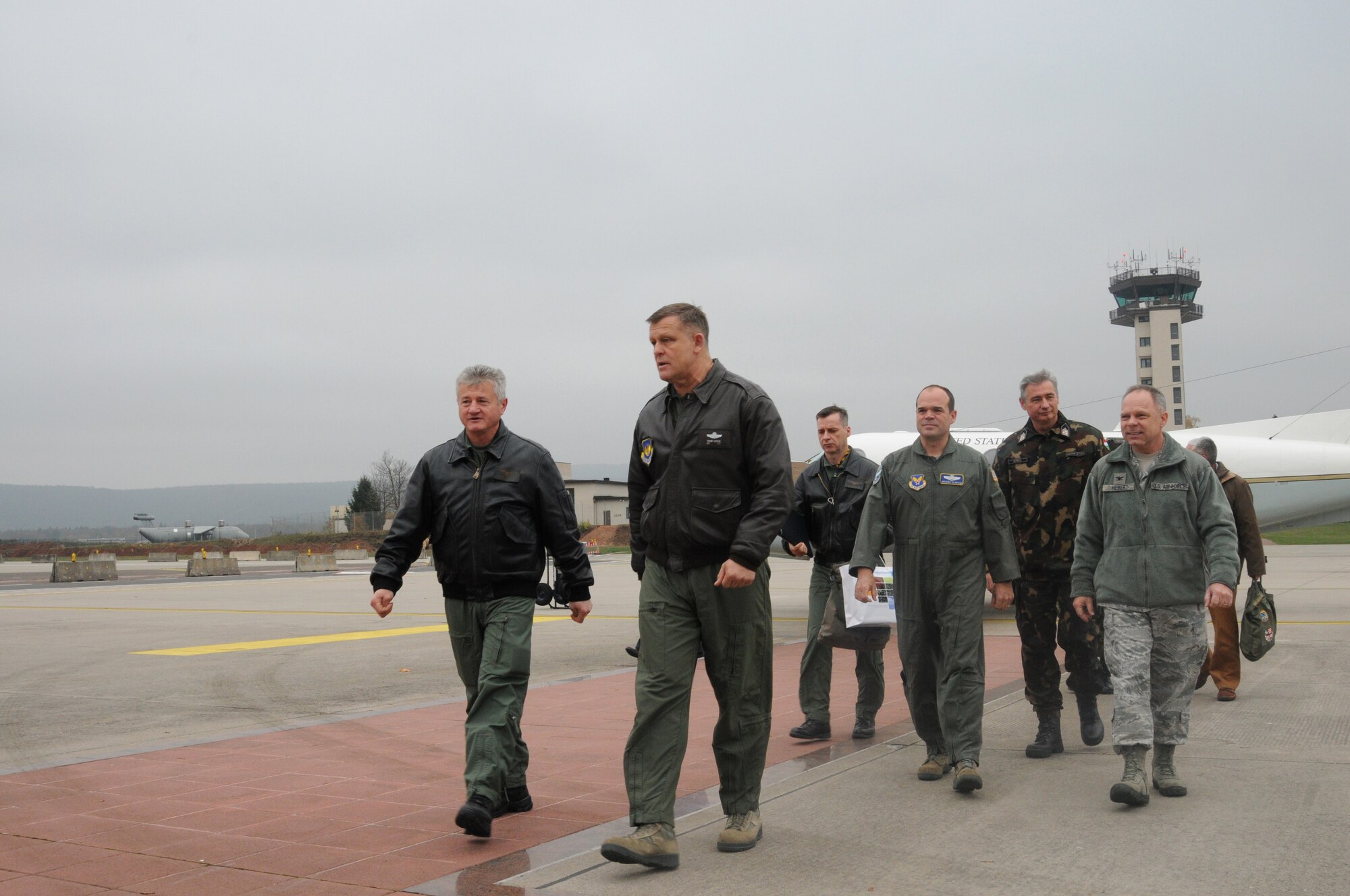 From left, Brig. Gen. Albert Safar, air chief of Hungarian Defense Forces; Gen. Frank Gorenc, U.S. Air Forces in Europe and Air Forces Africa commander; walk toward their vehicles after meeting at the distinguished visitor ramp here Nov. 18, 2013. During Safar’s visit he met with Gorenc and Lt. Gen. Dominique de Longvilliers, deputy commander for Headquarters Allied Air Command. (U.S. Air Force Photo by Tech. Sgt. James M. Hodgman) 