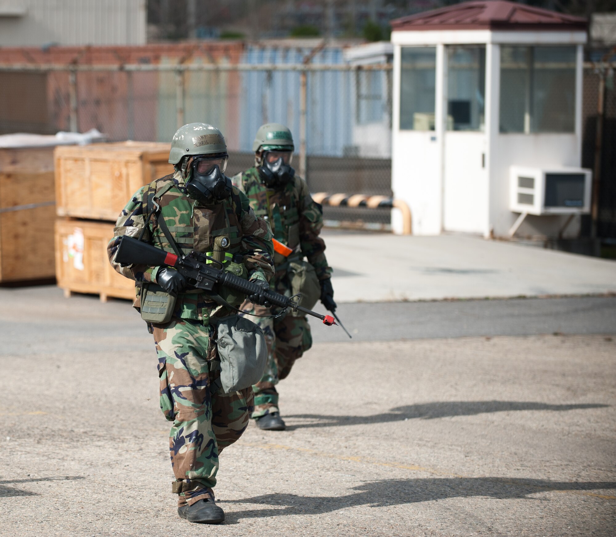 Tech. Sgt. Christopher Little, left, and Staff Sgt. Daniel Vega, right, both from the 8th Logistics Readiness Squadron, conduct post attack reconnaissance during an exercise at Kunsan Air Base, Republic of Korea, Nov. 20, 2013. Kunsan continued exercise Beverly Bulldog 14-01 with more simulated hostile actions such as missile, mortar and ground attacks. The base tested its ability to survive and continue its primary missions under simulated hostile field conditions. The Wolf Pack, along with other 7th Air Force units, continued performing its operational and tactical wartime missions during the peninsula-wide exercise. (U.S. Air Force photo by Senior Airman Armando A. Schwier-Morales)