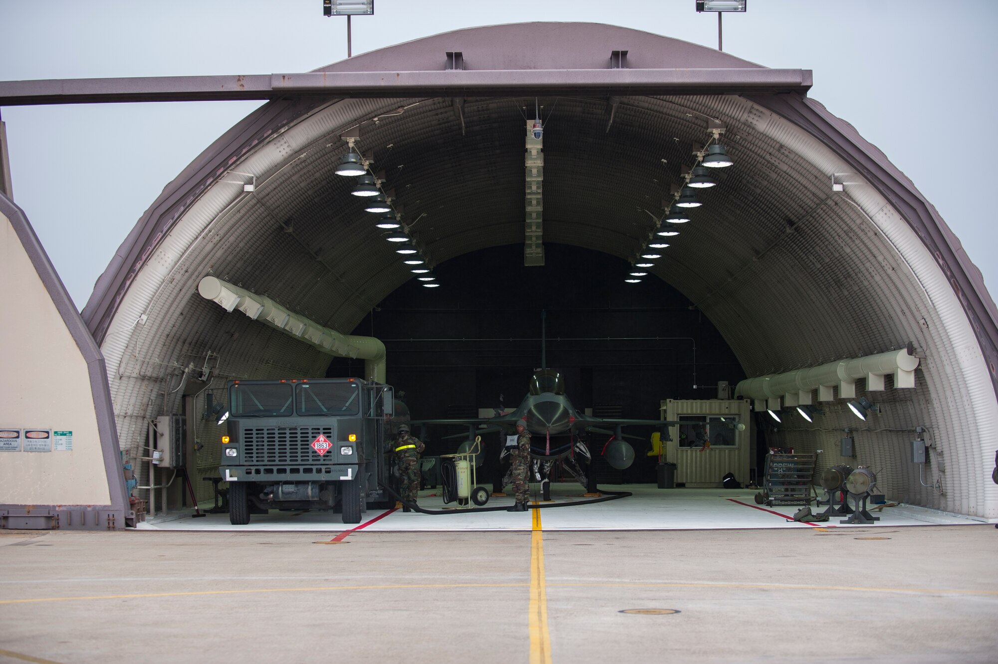 Airmen from the 8th Aircraft Maintenance Squadron refuel an F-16 during exercise Beverly Bulldog 14-01 at Kunsan Air Base, Republic of Korea, Nov. 20, 2013. Exercise Beverly Bulldog 14-01 demonstrates and enhances the readiness of 7th Air Force to defend and sustain the capabilities which strengthen the ROK-U.S. Alliance. (U.S. Air Force photo by Senior Airman Clayton Lenhardt/Released)
