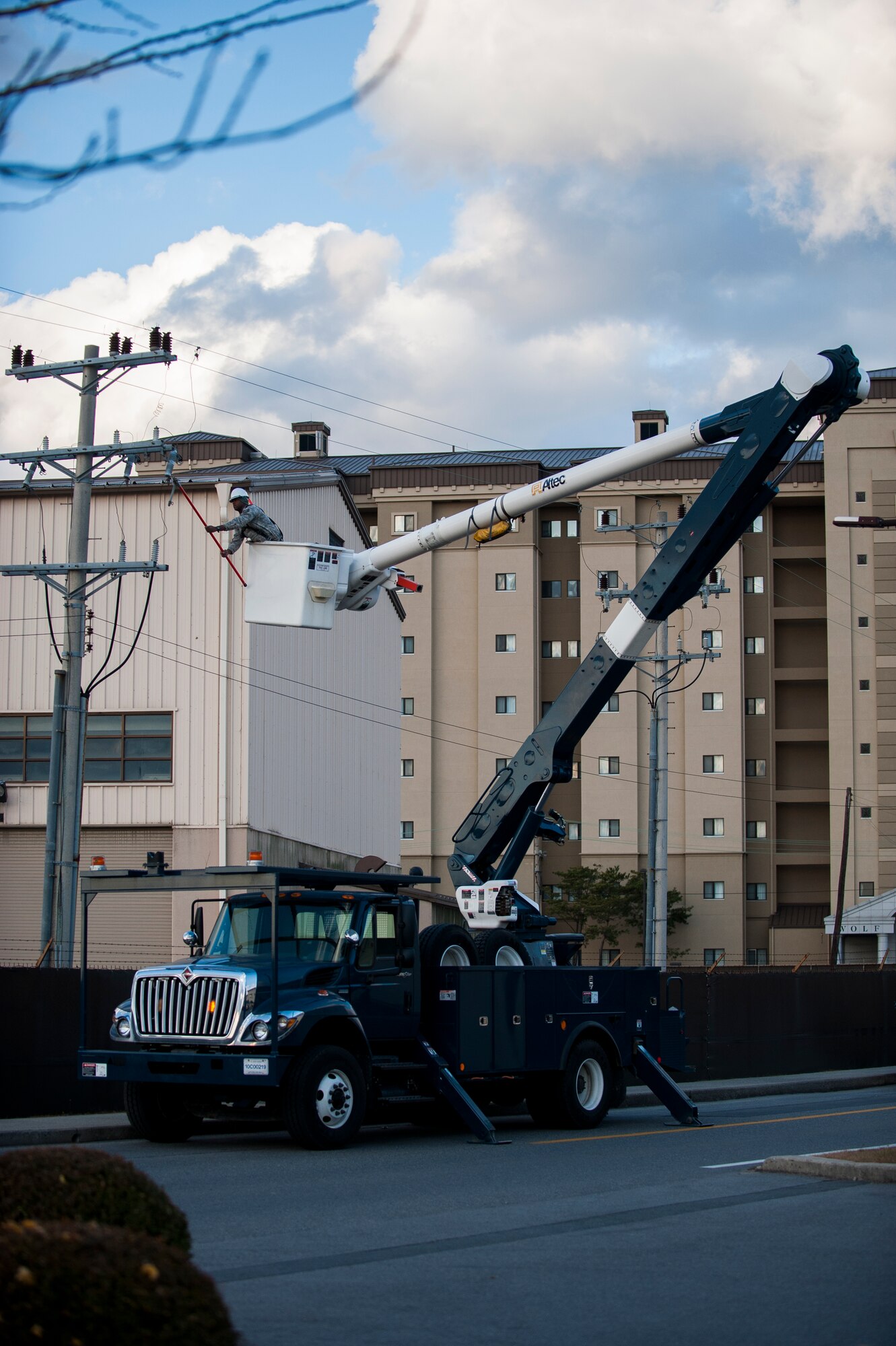 Tech. Sgt. Donald Ingram, 8th Civil Engineer Squadron, works to restore power to the main gate at Kunsan Air Base, Republic of Korea, Nov. 20, 2013. A mechanical failure disrupted gate functions for a short period of time before the 8th CES restored power. (U.S. Air Force Photo by Senior Airman Clayton Lenhardt/Released)