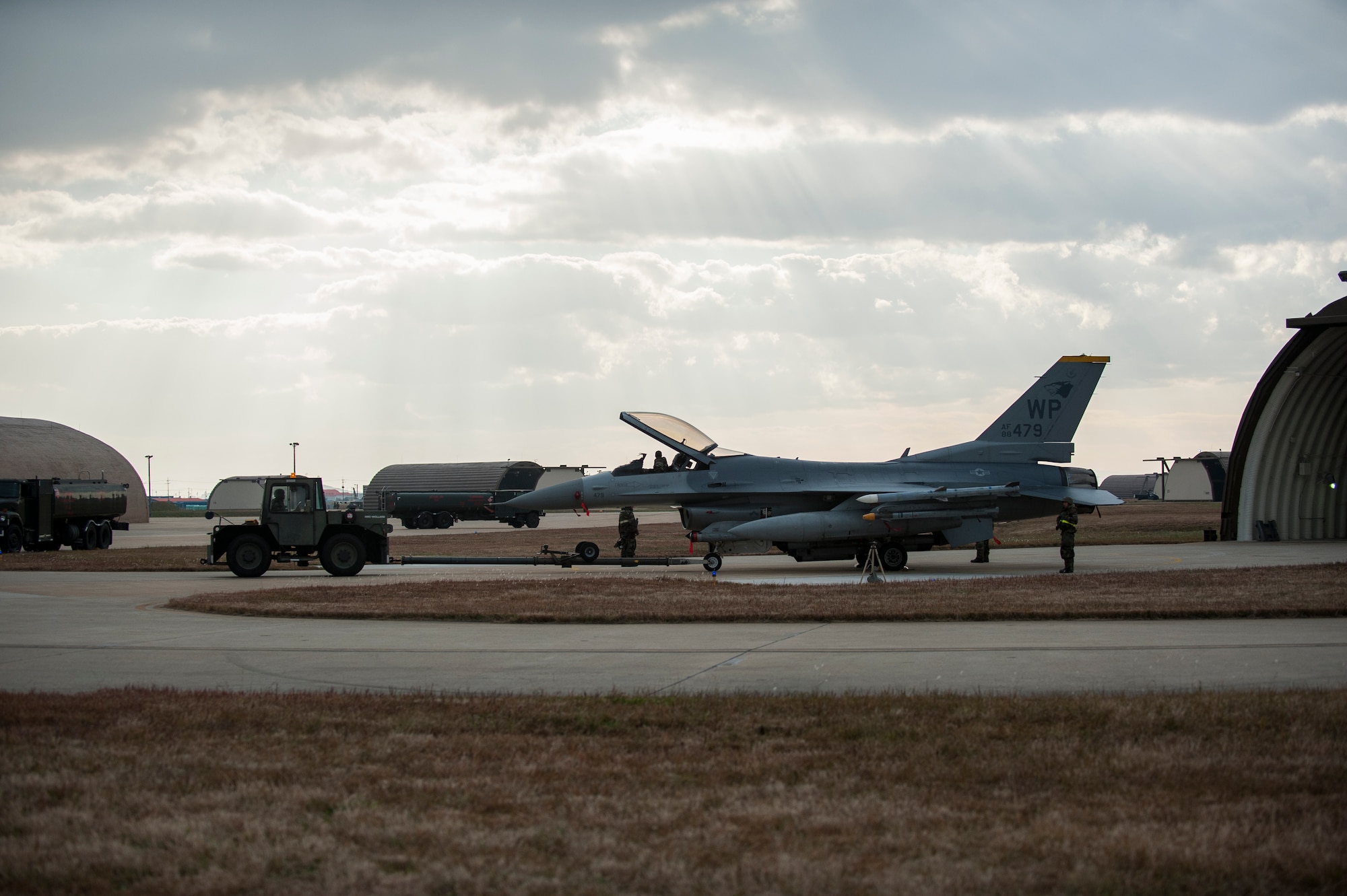 Wolf Pack Airmen prepare an F-16 for refueling and arming during Exercise Beverly Bulldog 14-01 at Kunsan Air Base, Republic of Korea, Nov. 20, 2013. Exercise Beverly Bulldog 14-01 demonstrates and enhances the readiness of 7th Air Force to defend and sustain the capabilities which strengthen the ROK-U.S. Alliance. (U.S. Air Force photo by Senior Airman Clayton Lenhardt/Released)