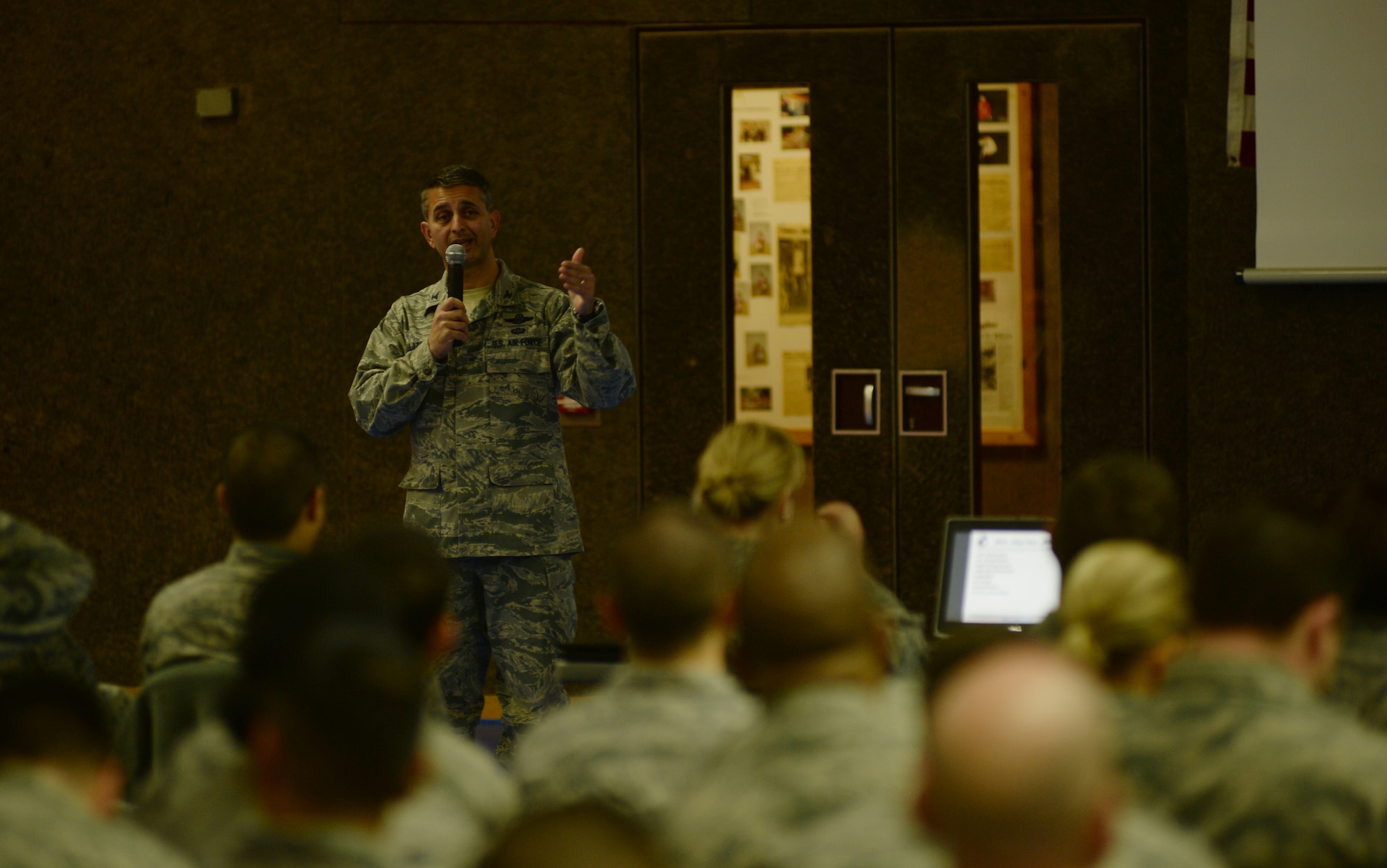 SPANGDAHLEM AIR BASE, Germany --- Col. David Julazadeh, 52nd Fighter Wing commander, emphasizes a point about safety while speaking during a commander’s call at the Skelton Memorial Fitness Center Nov. 18, 2013. Julazadeh also shared his assessment of the wing’s performance throughout 2013. (U.S. Air Force photo by Staff Sgt. Joe W. McFadden / Released)