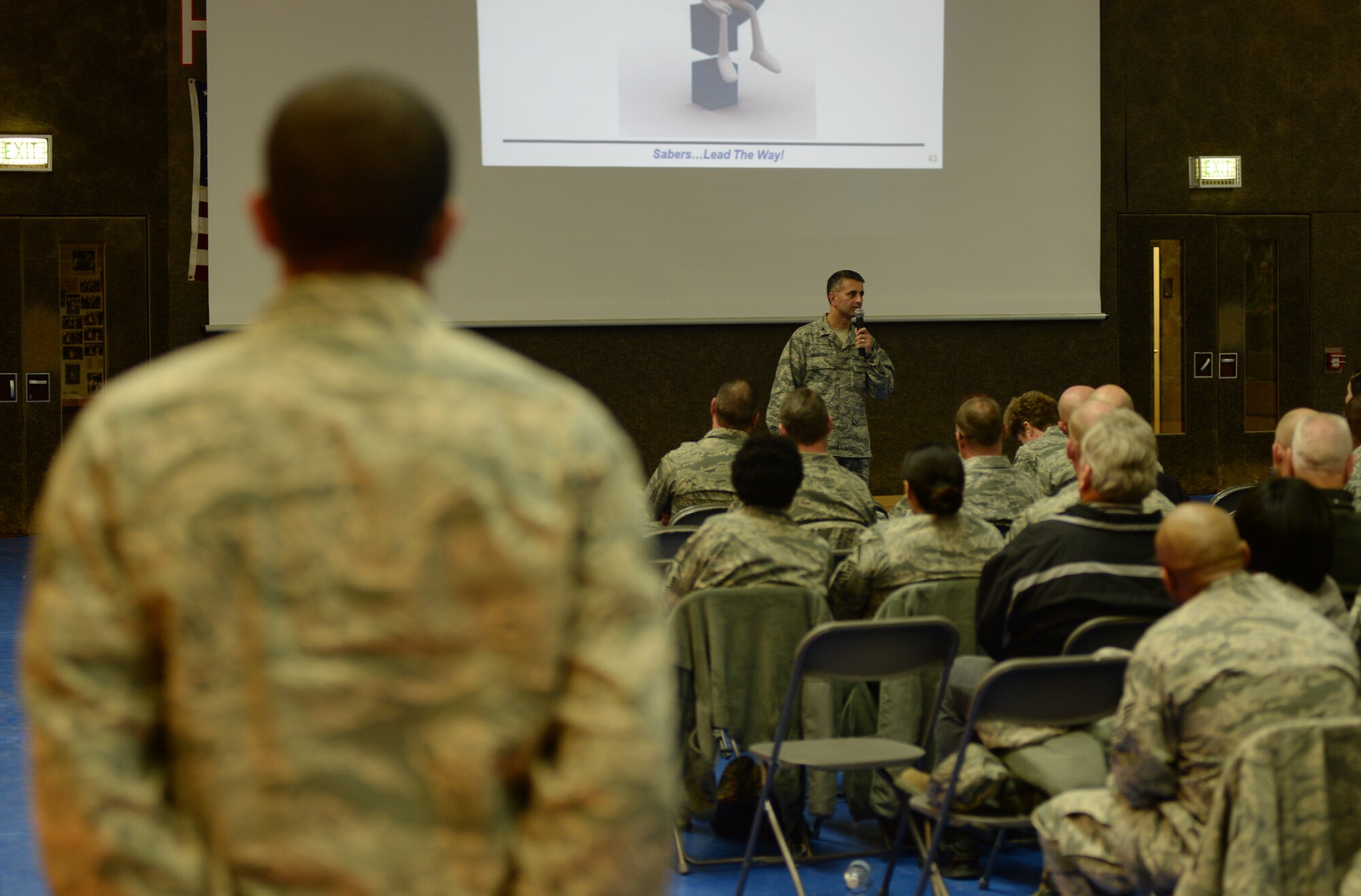 SPANGDAHLEM AIR BASE, Germany --- Col. David Julazadeh, 52nd Fighter Wing commander, speaks to Airmen during the question-and-answer portion during a commander’s call at the Skelton Memorial Fitness Center Nov. 18, 2013. The commander conducted three calls, themed “Faces of Spangdahlem” to share his assessment on the state of the wing in 2013 and its mission of defending American and Allied interests while building partner capacities. (U.S. Air Force photo by Staff Sgt. Joe W. McFadden / Released)