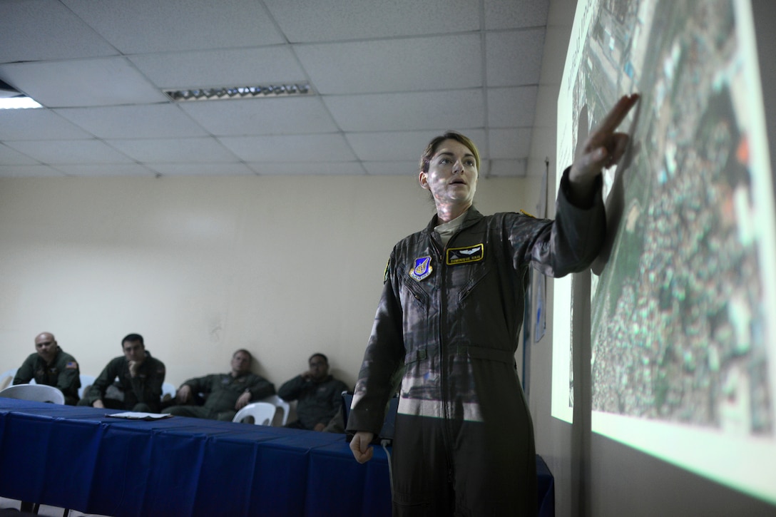 U.S. Air Force Capt. Dominique Haig briefs C-130H aircrews before a nighttime airlift mission in support of Operation Damayan at Clark Air Base, Philippines, Nov. 18, 2013. Haig is assigned to the 36th Airlift Squadron. The 36th Airlift Squadron supports the 3rd Marine Expeditionary Brigade in assisting the Philippines ongoing relief efforts in response to the aftermath Typhoon Haiyan.