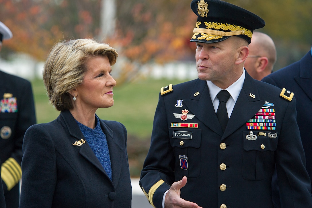U.S. Army Major Gen. Jeffrey S. Buchanan, right, greets Australian Foreign Affairs Minister Julie Bishop in Arlington National Cemetery, Va., Nov. 20, 2013.