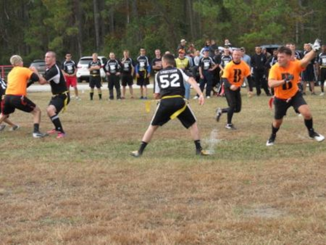 Marines on the “MACS-2 Muts” flag football team drop into coverage, as Marines from the “B Team” head downfield during their annual Turkey Bowl tournament Friday at Marine Air Control Squadron 2’s headquarters building. The “B Team” went undefeated until their re-match with the Bogue Rat in the championship game.


