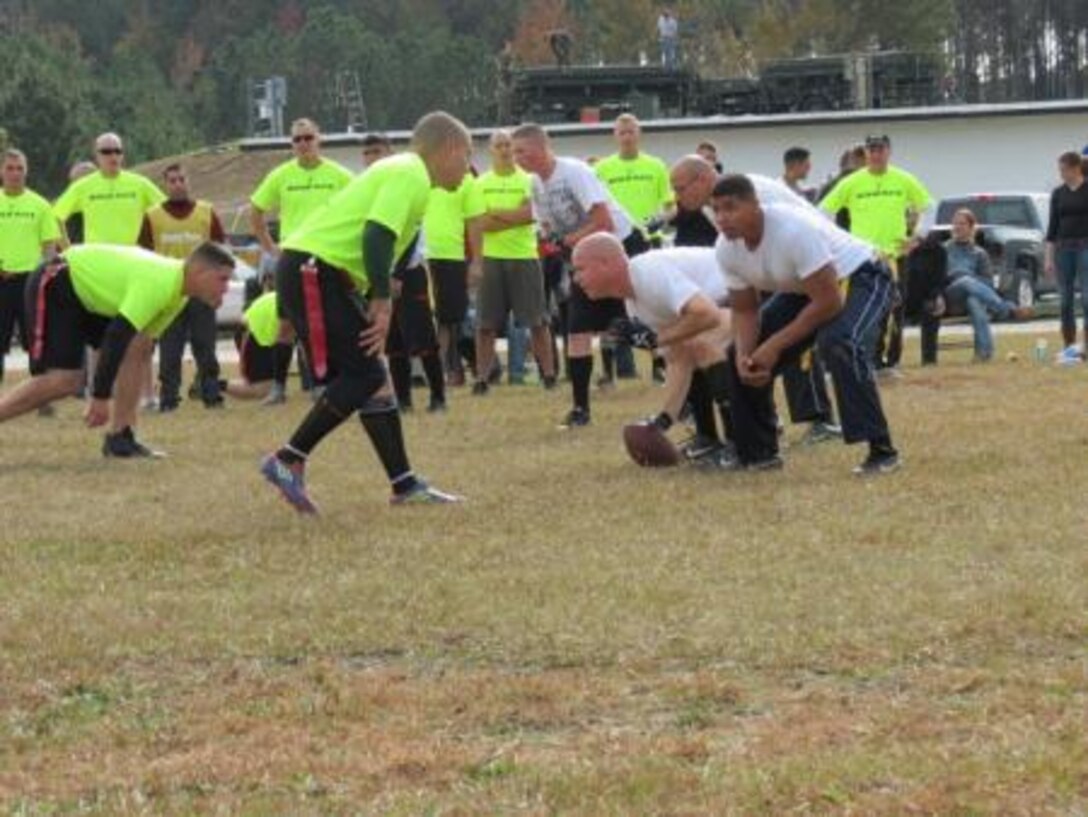 Turkey Bowl defending champions, the “Bogue Rats,” line up against their opponents during this year’s competition here Friday. The annual flag football tournament hosted by Marine Air Control Squadron 2 fosters friendly competition among the unit’s detachments.



