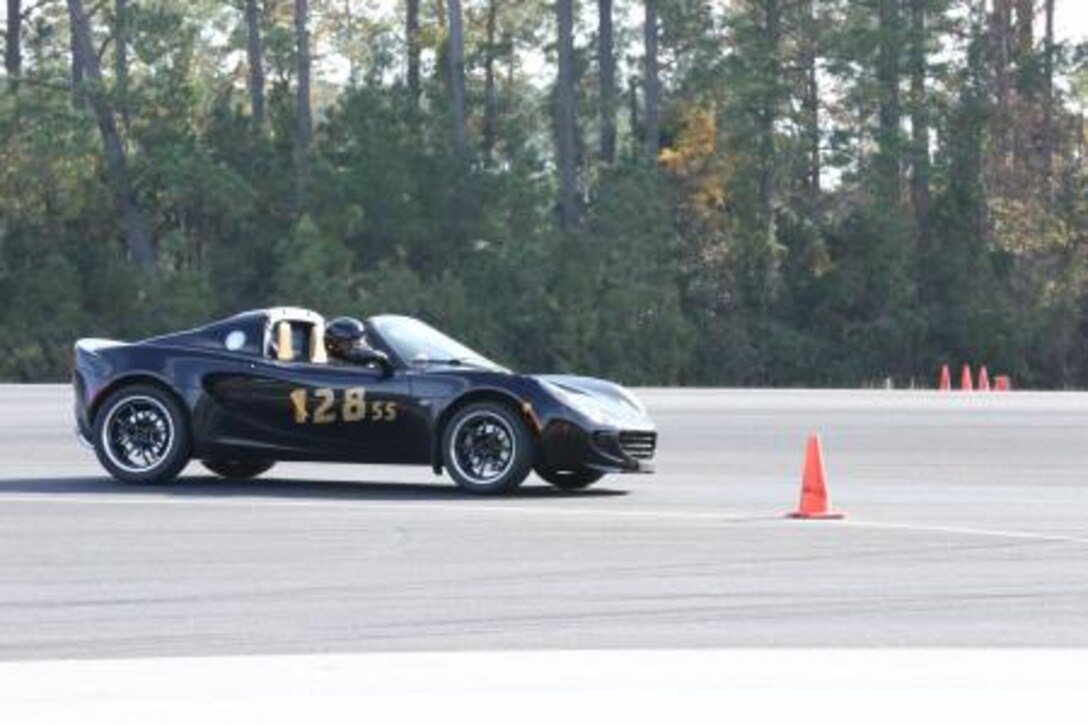 A Sports Car Club of America instructor demonstrates the autocross course on the flight line here Nov. 16. The course built drivers confidence in being able to maneuver and control their vehicles.


