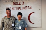 Army Maj. Elizabeth Nance, a dental officer with the Virginia Army National Guard currently assigned to the ROLE 3 hospital at Kandahar Airfield, Afghanistan, stands with her son, Marine Corps Capt. Wilson Nance.