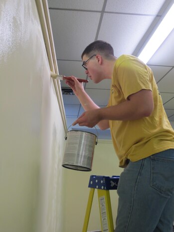 3/6 Navy Corpsman 6th Marine Regiment, 2nd Marine Division RP3 Jahr, Michael helping out at the Onslow Community Outreach center touching up the edges.