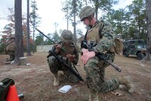 Marines with Transportation and Support Company, Combat Logistics Battalion 2, 2nd Marine Logistics Group demonstrate proficiency with programming and using a radio during a fire team challenge at the Lejeune Military Operations on Urbanized Terrain (MOUT) town aboard Camp Lejeune, N.C., Nov. 20, 2013. Each fire team was timed and evaluated at each station. (U.S. Marine Corps photo by Lance Cpl. Shawn Valosin)