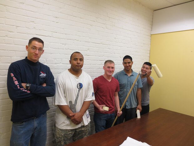 (left to right) 1stLt Rock, Lt Jones, Cpl Braastad, Cpl Guarnero, Cpl her with 3/6 6th Marine Regiment, 2nd Marine Division take a break from painting at the Onslow Community Outreach Center to pose for the camera.