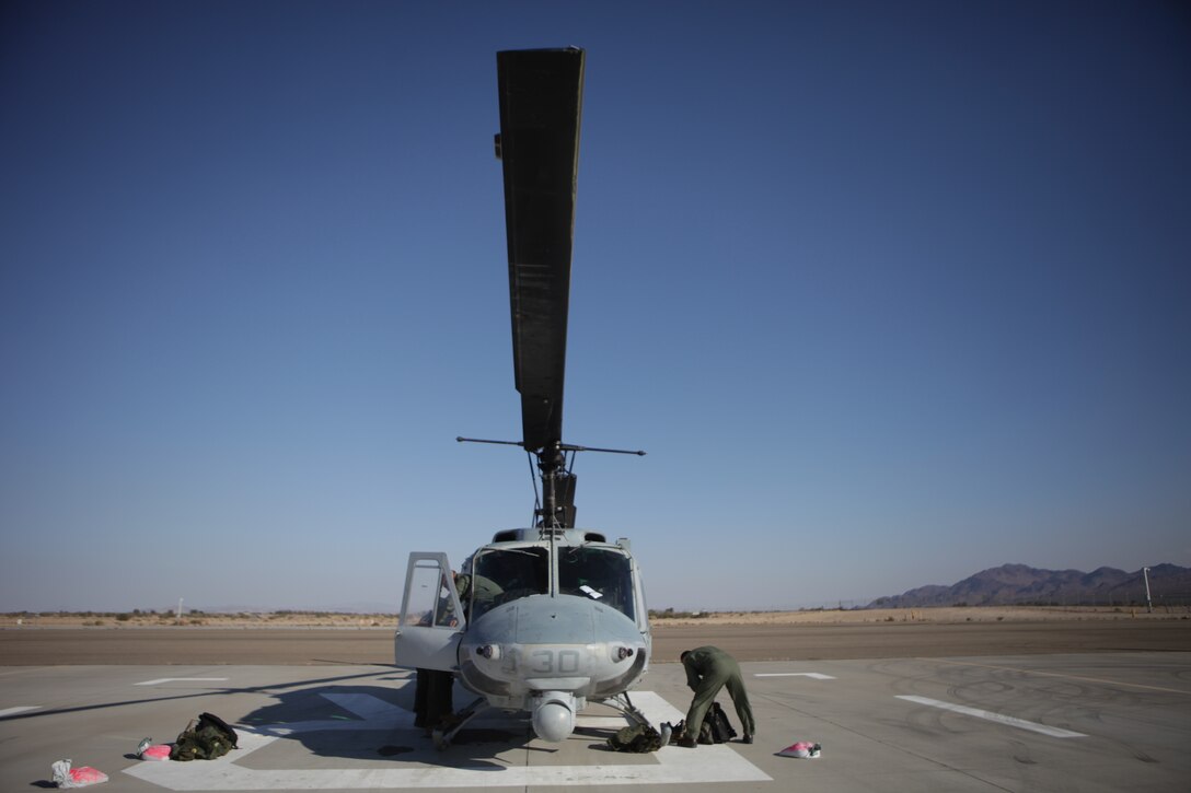 Marines of Light Attack Helicopter Squadron 773 prepare for a flight near Barstow, Calif. Nov. 15, 2013, in support of exercise Raven 14-01. Exercise Raven is an aviation training exercise designed to provide air support to Marine Corps Forces Special Operations Command to better prepare them for their upcoming deployment. (Official photo by Lance Cpl. Brytani Musick)