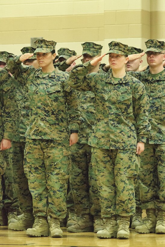 Pfc. Cristina Fuentes Montenegro, 25, one of the first three female Marine graduates from the School of Infantry-East’s Infantry Training Battalion course, and native of Coral Springs, Fla., left, and Pfc. Julia Carroll, 18, one of the first three female Marine graduates from the School of Infantry-East’s Infantry Training Battalion course, and native of Idaho Falls, Idaho, salute during the graduation of Delta Company, Infantry Training Battalion, School of Infantry-East at Camp Geiger, N.C. Nov. 21. The graduation of 227 students marked the first class of Marines to include females. The class was part of the Marine Corps’ research effort toward integrating women into ground-combat military occupational specialties. (Official U.S. Marine Corps photo by Lance Cpl. Justin A. Rodriguez/Released)