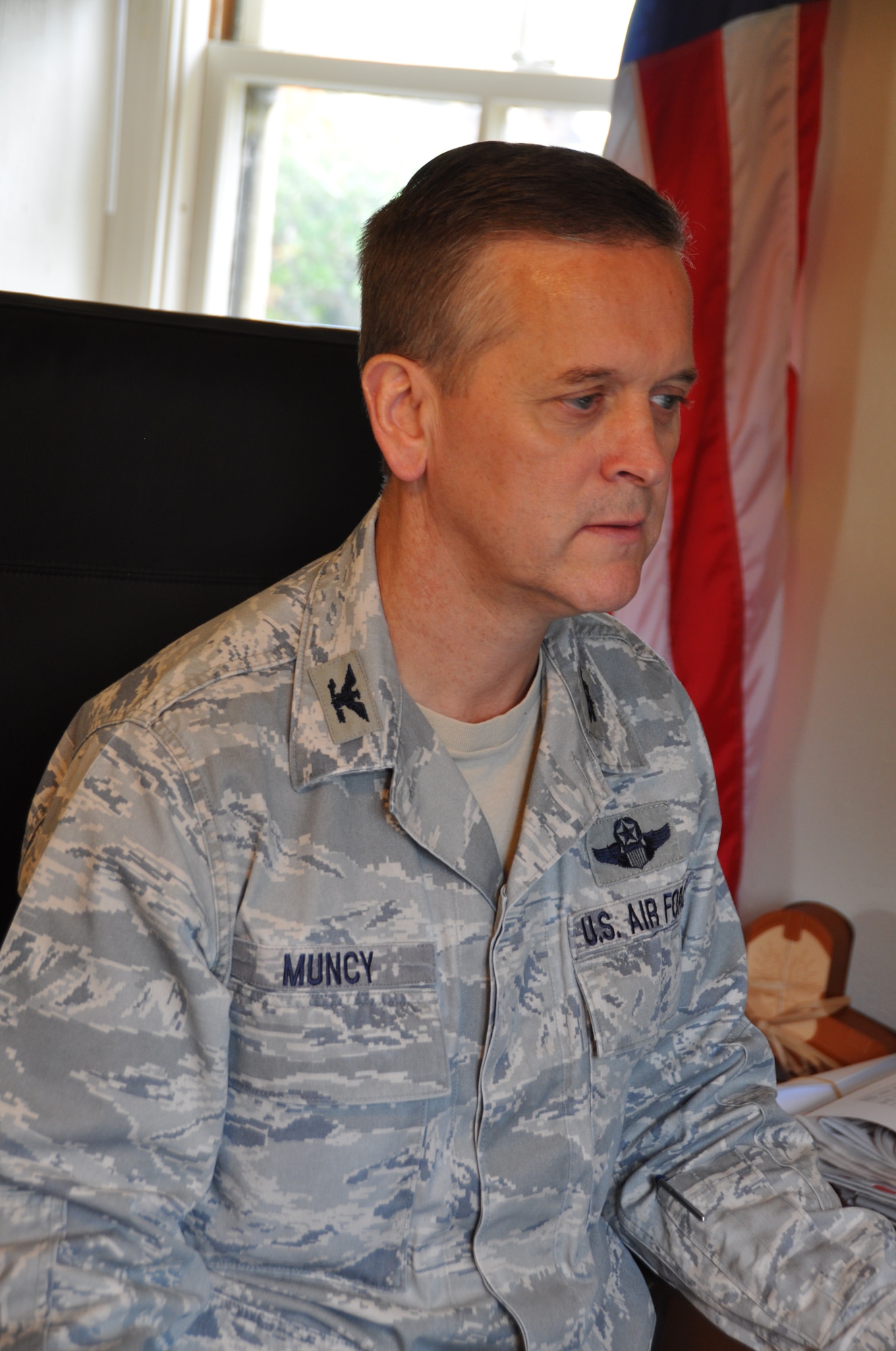 Col. Russell Muncy answers e-mails from his new office in the Hap Arnold House at March Air Reserve Base, Calif., Nov. 15, 2013. Muncy was gained as the commander of the 452nd Air Mobility Wing on Nov. 3 and will assume command at a ceremony Nov. 23. (U.S. Air Force photo/Linda Welz)