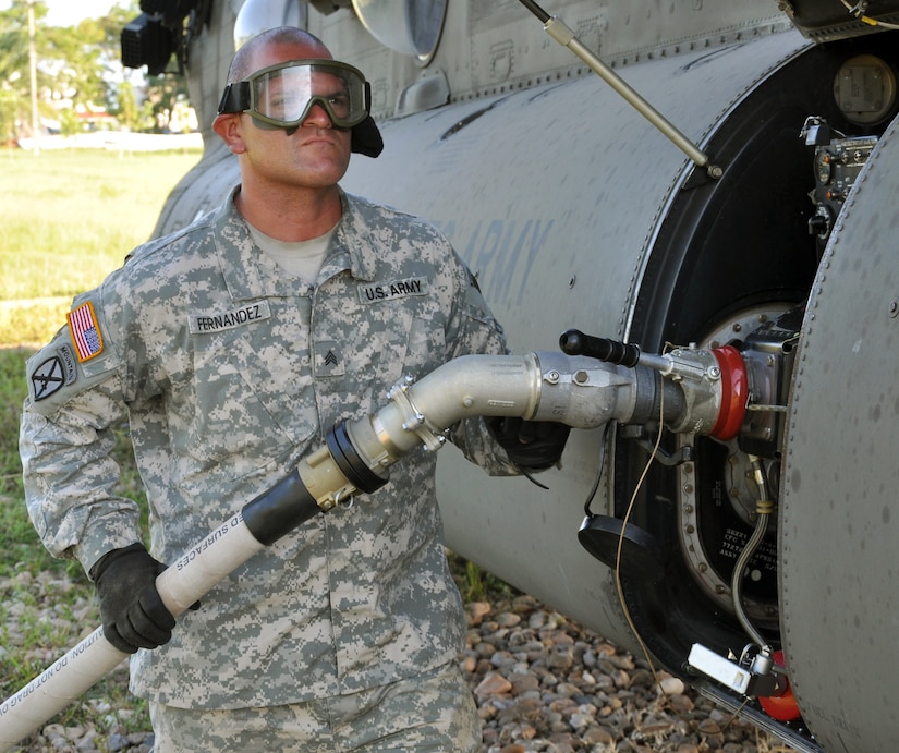 U.S. Army Sgt. Erick Fernandez refuels a UH-60 Blackhawk helicopter assigned to the 1-228th Aviation Regiment at Puerto Castilla, Honduras, Nov. 19, 2013.  The 1-228th conducted a week-long Collective Training Exercise (CTE), during which the unit lived in field conditions and responded to both exercise and real world mission requirements.  (U.S. Air Force photo by Capt. Zach Anderson)