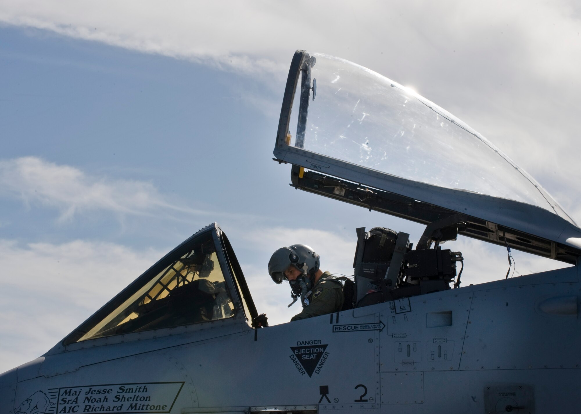 U.S. Air Force Maj. Joe McGill, 40th Flight Test Squadron A-10 Thunderbolt II Experimental pilot, communicates with crew chiefs during pre-flight checks, Nov. 18, 2013, at Nellis AFB, Nev. The A-10 Thunderbolt II was designed around the GAU-8 Avenger, a 30mm rotary cannon that is the airplanes primary armament and the heaviest cannon mounted on an aircraft. (U.S. Air Force photo by Airman 1st Class Jason Couillard)