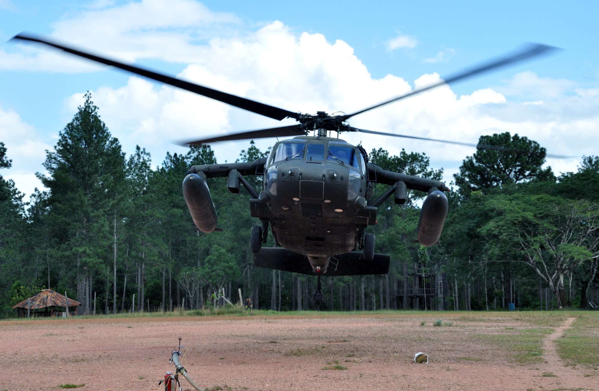 A UH-60 Blackhawk helicopter assigned to the 1-228th Aviation Regiment lifts off from Mocoron, Honduras, Nov. 19, 2013.  The helicopter was responding to a training scenario as part of a week-long Collective Training Exercise (CTE) being condcuted by the 1-228th.  (U.S. Air Force photo by Capt. Zach Anderson)