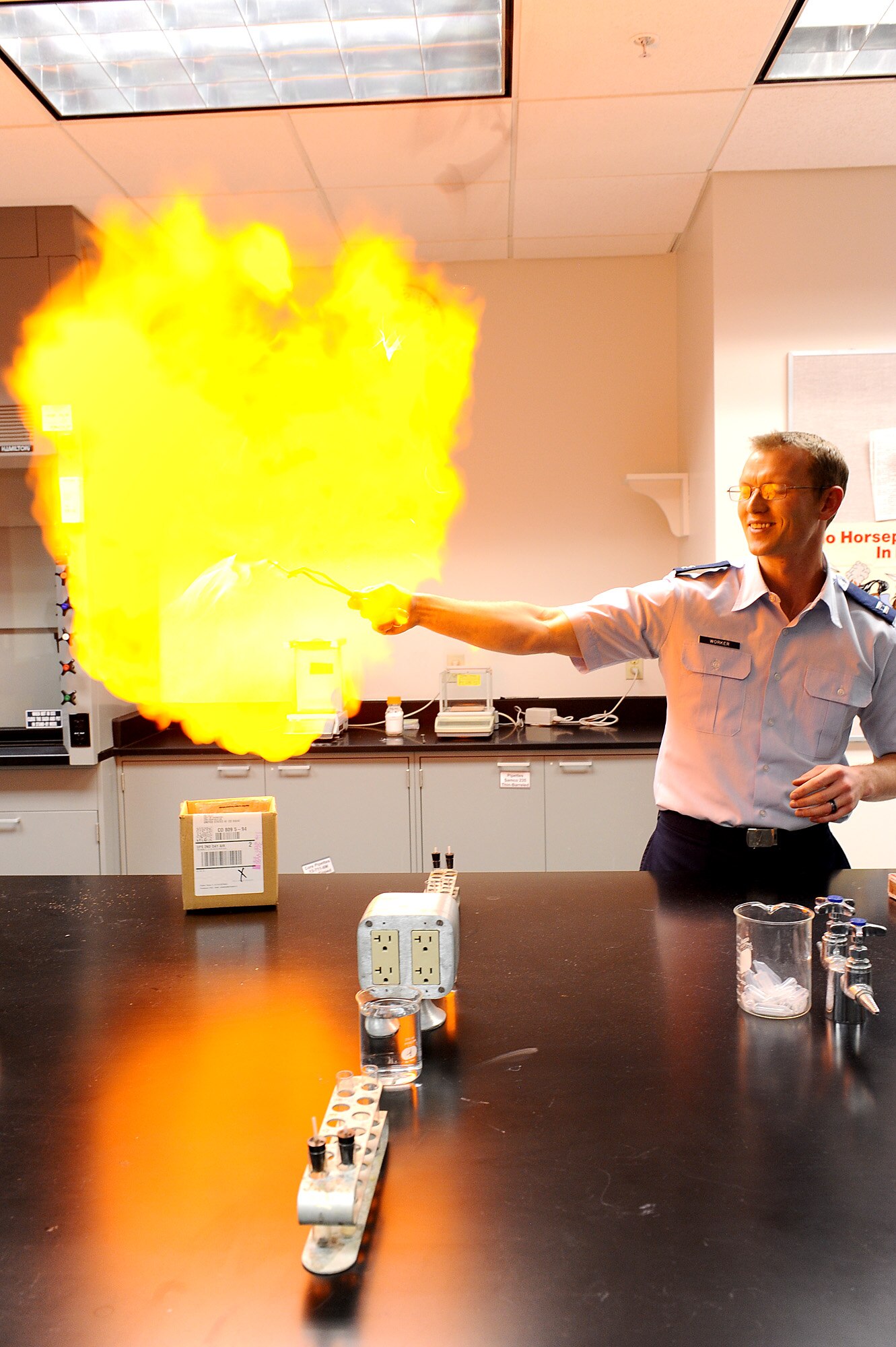 Capt. Ben Worker demonstrates the combustibility of hydrogen in the Academy’s chemistry lab Nov. 14. Worker’s demonstration was one of several activities occurring on Wingman Day, a day designed to encourage Academy staff members to focus on the institution’s most valuable asset — Airmen. Worker is an instructor in the Academy’s Chemistry Department.