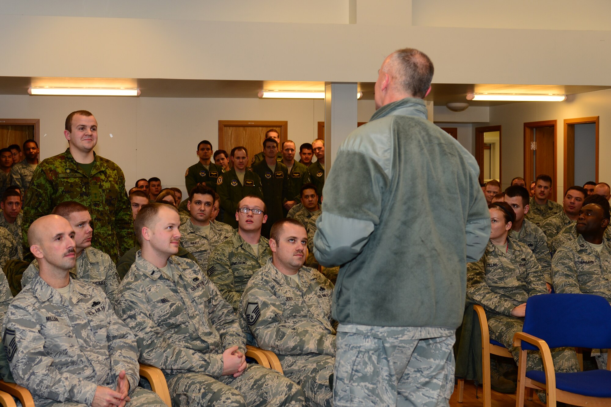 Lt. Gen. Craig Franklin, 3rd Air Force and 17th Expeditionary Air Force commander, thanks 2nd Lt. Madis Toomla, Estonian air force flight allocator, for working together with North Atlantic Treaty Organization partners at Keflavik International Airport, Iceland, Nov. 14, 2013. Franklin thanked Airmen for their hard work and dedication during this deployment and reminded Airmen how important the unique mission is here. The 48th Air Expeditionary Group has been maintaining the NATO air surveillance and policing mission here since Oct. 28, 2013. (U.S. Air Force photo by Airman 1st Class Dana J. Butler/Released) 