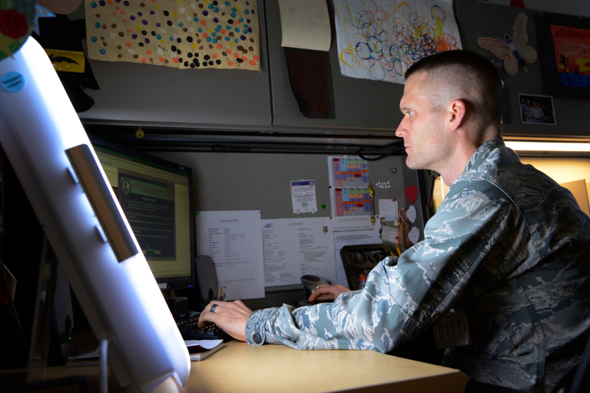 Air Force Capt. Joel Cartier, 673d Mental Health social worker, uses a 'happy light' on Joint Base Elmendorf-Richardson, Alaska, Nov. 13, 2013. Happy lights are used as a light therapy to combat seasonal affective disorder during the cold harsh winter months. (U.S. Air Force photo/Staff Sgt. Sheila deVera)