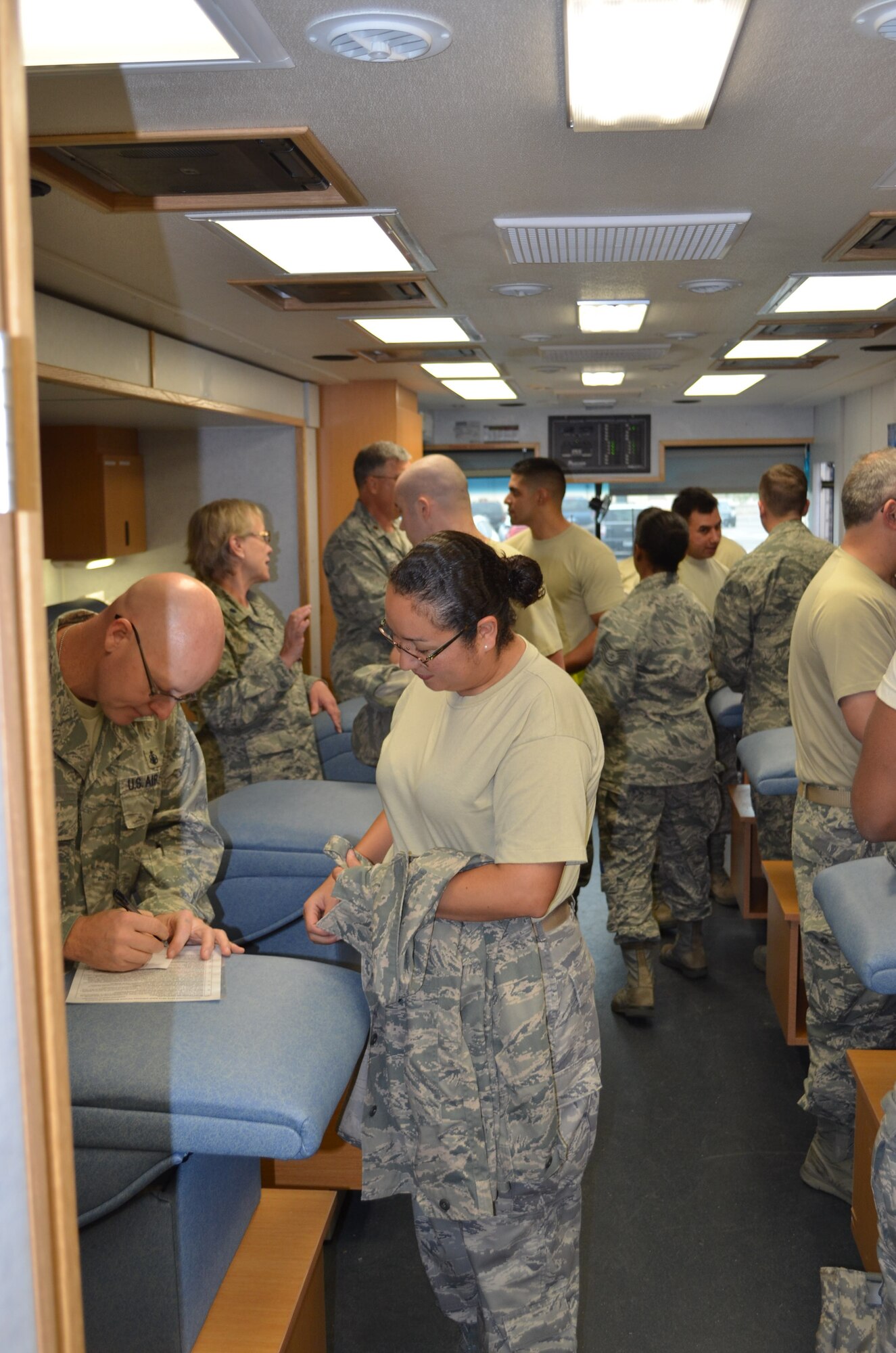 433rd Airlift Wing Airmen prepare to receive their annual influenza vaccination via the Lackland Blood Donor Center mobile unit on Nov. 16, 2013. (U.S. Air Force Photo/Maj. Tim Wade)