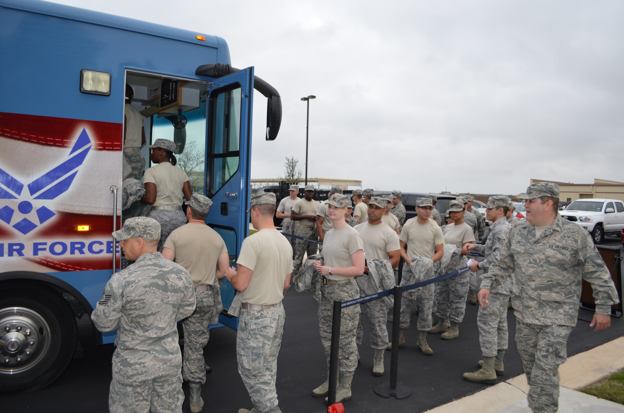 433rd Airlift Wing Airmen prepare to enter the Lackland Blood Donor Center mobile unit on Nov. 16, 2013 to receive their annual influenza vaccination. (U.S. Air Force Photo/Maj. Tim Wade)
