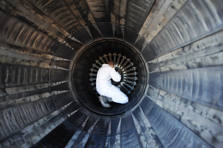U.S. Air Force Staff Sgt. Ryan Blanton, 7th Aircraft Maintenance Squadron, thoroughly inspects the inside a F101-102 engine on a B-1B Lancer Nov. 17, 2013, at Dyess Air Force Base, Texas. Blanton will soon be leaving Dyess, to be a part of Presidential Support Team at Andrews Air Force Base, Md. (U.S. Air Force photo by Airman 1st Class Alexander Guerrero/Released)