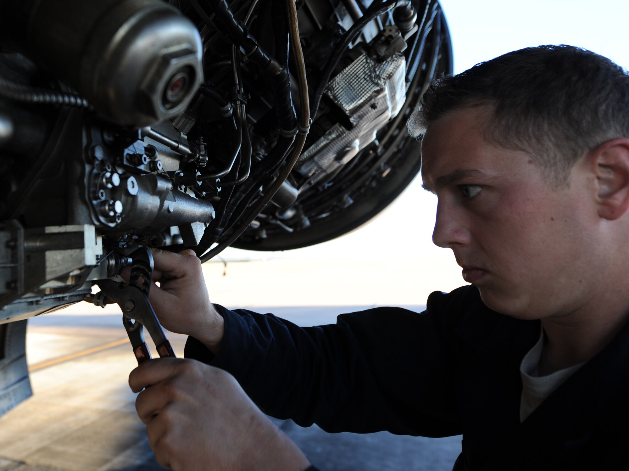 U.S. Air Force Staff Sgt. Ryan Blanton, 7th Aircraft Maintenance Squadron, checks the connection to a fuel system component Nov. 17, 2013, at Dyess Air Force Base, Texas. Blanton has extensive training on B-1 engine maintenance and is qualified to completely remove, disassemble and reassemble the jet engines. (U.S. Air Force photo by Airman 1st Class Alexander Guerrero/Released)

