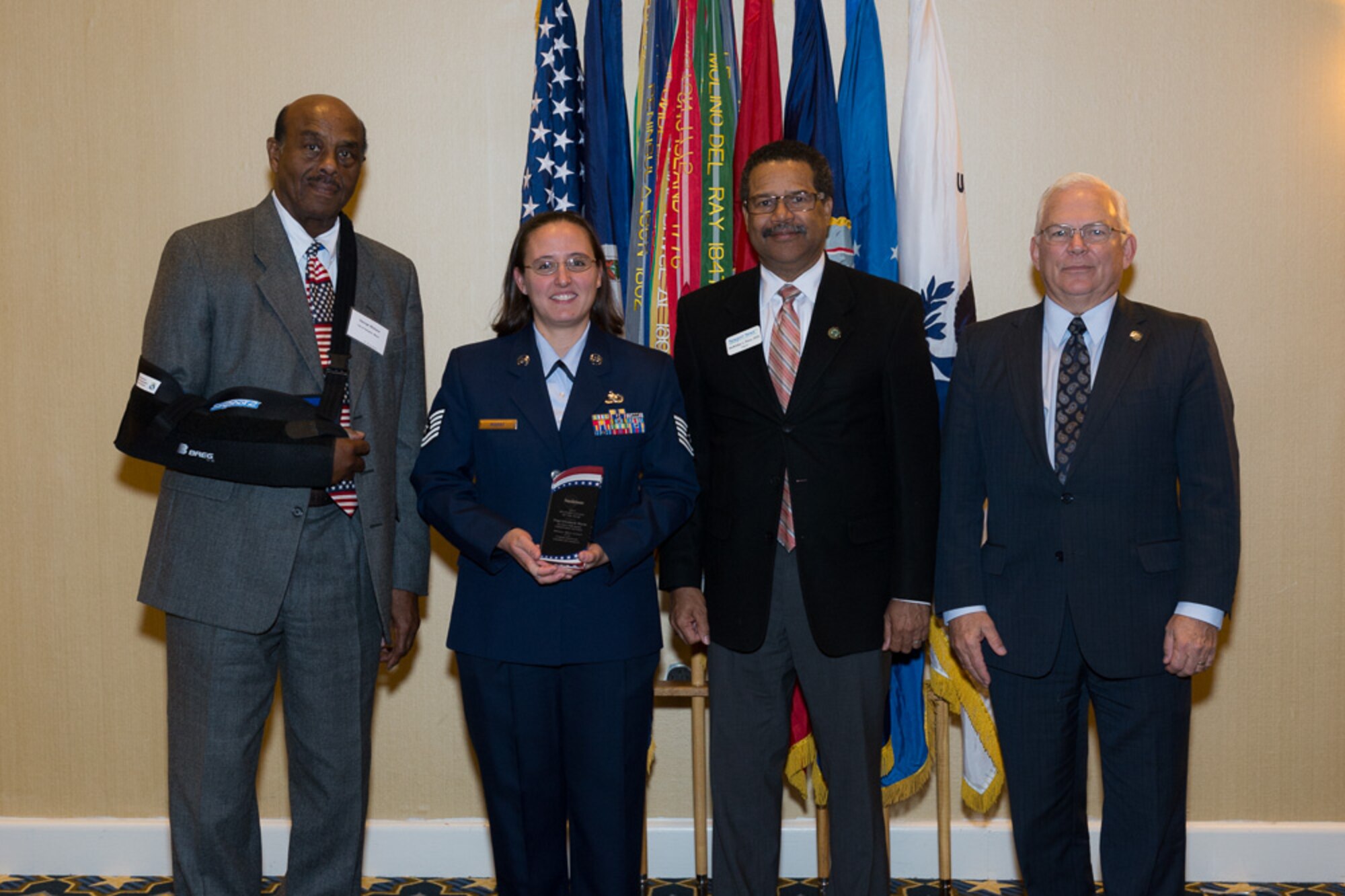 Tech. Sgt. Elizabeth Marat of the 480th Intelligence, Surveillance and Reconnaissance Wing, poses with Hampton, Va., civic leaders at a Military  Recognition Luncheon recognizing military members for their community involvement. Marat was the Air Force 2013 Military Citizen of the Year for her volunteer efforts. From left to right: Hampton Mayor George Wallace, Marat, Newport News Mayor McKinley Price and Mike Kuhns, Virginia Peninsula Chamber of Commerce president. (Courtesy Photo)