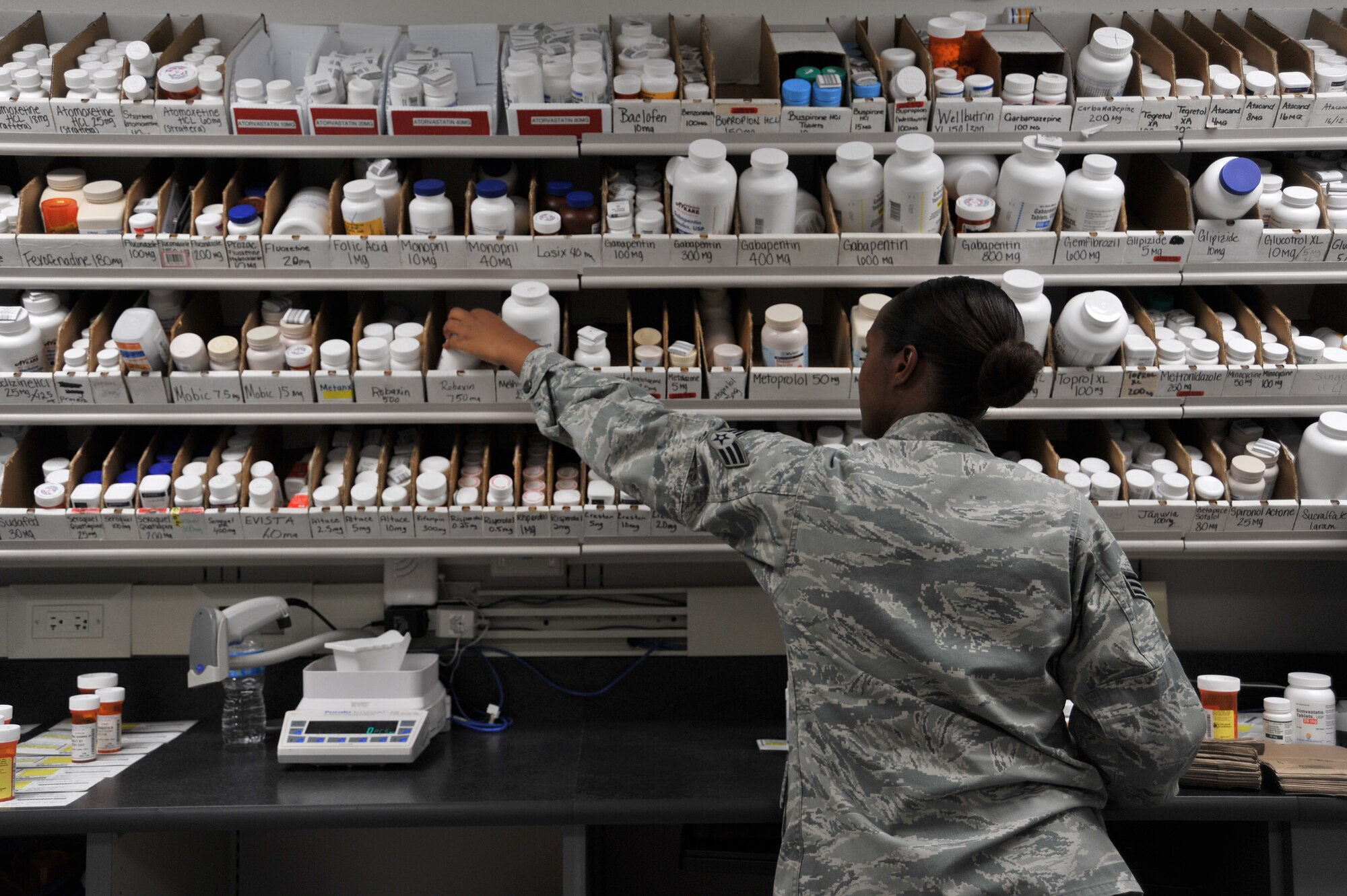 Senior Airman Lesley Perry, pharmacy technician, fills prescriptions at Maxwell Air Force Base, Nov. 6. During the medical group’s recent inspection, the pharmacy was instrumental in the group receiving a rating of excellent, with the pharmacy earning a perfect score with no findings. (U.S. Air Force photo by Staff Sgt. Natasha Stannard)