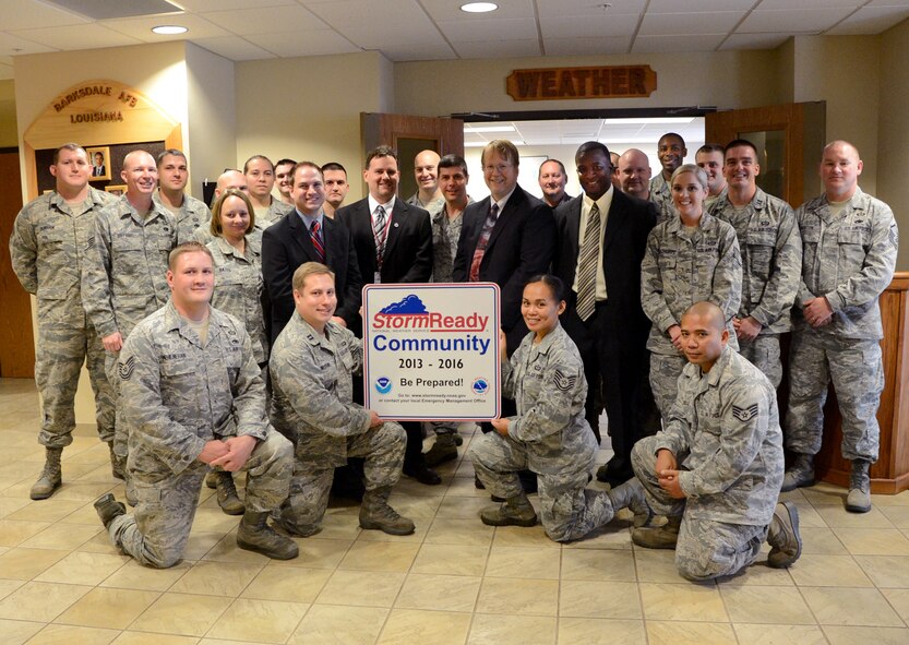 Col. Andrew Gebara, 2nd Bomb Wing commander, local Nation Weather Service representatives and 2nd Operations Support Squadron Airmen pose for a photo during a ceremony on Barksdale Air Force Base, La., Nov. 15, 2013. Home to more than 15,000 residents, Barksdale is the first military installation in Louisiana and the only base in the Air Force Global Strike Command to be recognized as a StormReady® Community by the National Weather Service. (U.S. Air Force photo/Staff Sgt. Amber Corcoran)
