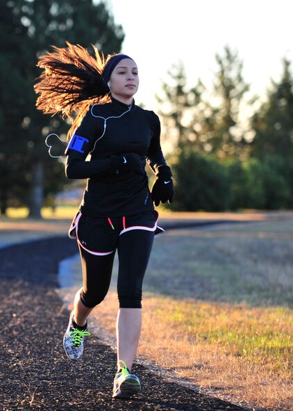 Airman 1st Class Savella Constancio, 436th Airlift Wing Judge Advocate military justice paralegal, runs on the base track Nov 18, 2013, at Dover Air Force Base, Del. Running is one of Constancio’s favorite hobbies. (U.S. Air Force photo/Airman 1st Class William Johnson)