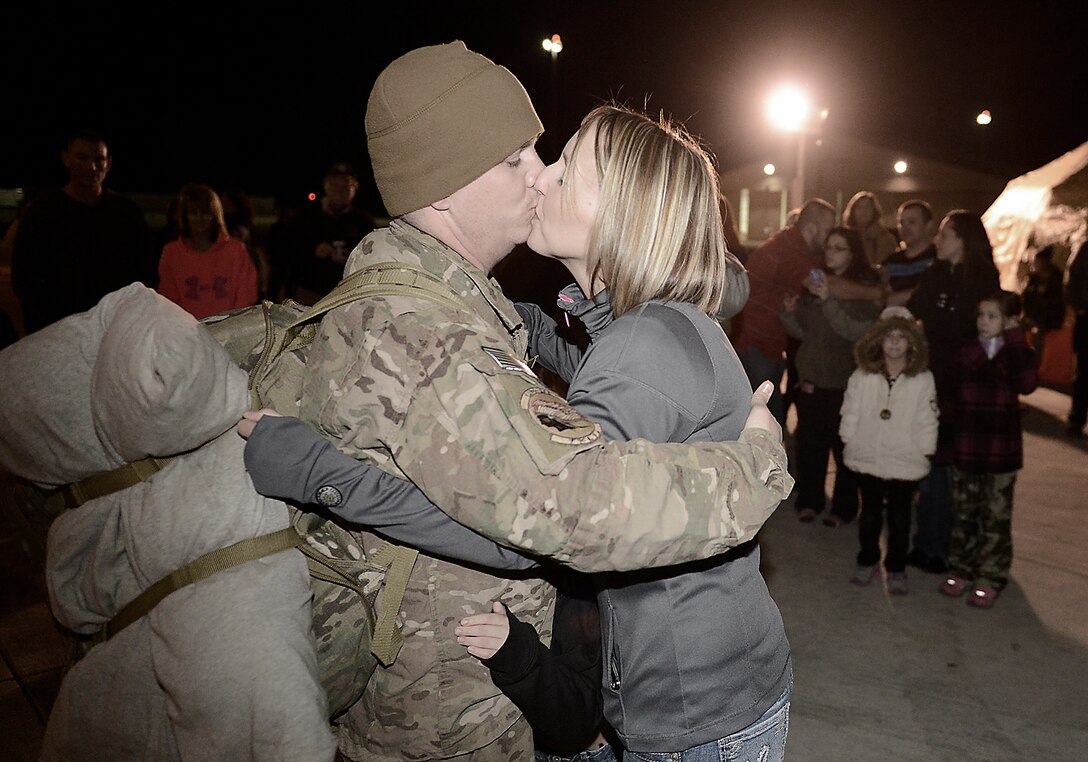 Returning deployer Master Sergeant Joshua Schell from the 138th Fighter Wing, Tulsa Air National Guard, is greeted by his wife Misty after returning  home from a deployment to Afghanistan.  (U.S.Air Force photo by Master Sgt. Mark A. Moore/Released)