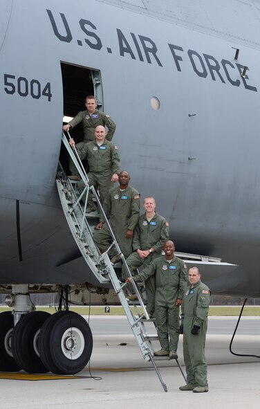 9th Airft Squadron crewmembers pose after delivering C-5M Super Galaxy, serial # 85-0004, to Dover Air Force Base, Del. on Nov. 21, 2013. 85-0004, is the 13th C-5M model to be delivered to the USAF and joins the 436th Airlift Wing, currently the sole front-line transport Wing to operate the C-5M. (U.S. Air Force photo/Greg L. Davis)
