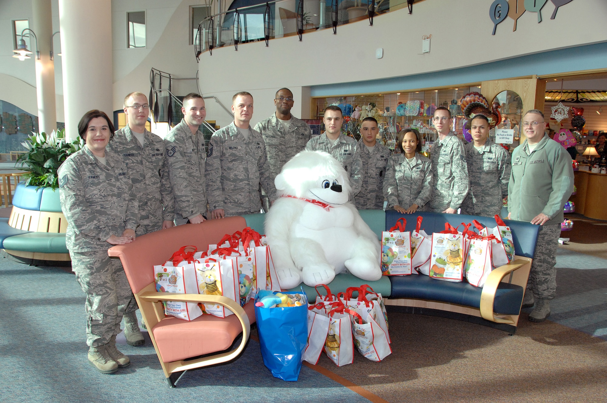 Volunteers from the Fightin’ 55th Wing at Offutt AFB, NE pose for a group photo inside the lobby of the Children’s Hospital and Medical Center in Omaha, NE, Nov. 20. The members visited with patients and delivered over 90 stuffed animals on behalf of the Air Force Sergeants Association, Chapter 984. The special Noah’s Ark Workshop animals included 64 monkeys, puppy dogs, bears and cows that were assembled by Offutt members. These animals included an internal pouch where patients could place a star after making a wish. All of the animals were made available through donations to Chapter 984 of the AFSA. (U.S. Air Force photo by Delanie Stafford/Released)