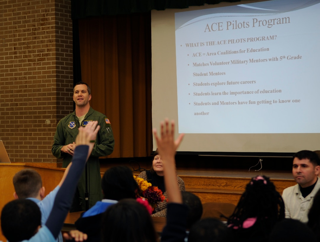 Lt. Col. Bill Sullivan, 811th Operations Group deputy commander, speaks to the fifth grade class at Francis T. Evans Elementary School about getting involved with the Area Coalitions for Education- Excellence (ACE-E) program Nov. 20, 2013. More than 15 Joint Base Andrews airmen volunteered for the ACE-E program which helps provide mentoring with technology tools, training, knowledge and skills that will allow students to compete successfully for meaningful jobs and lifelong careers. Sullivan is the JBA Chairman and Officer-In-Charge of the ACE-E program. (U.S. Air Force photo by/ Airman 1st Class Nesha Humes)